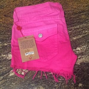 True religion cutoff shorts.